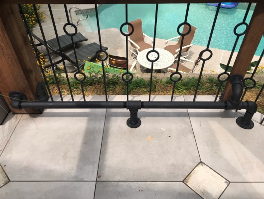 rail and tile with pool in background
